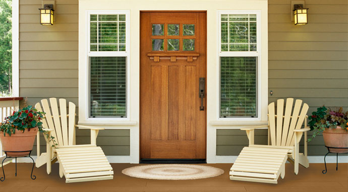 A porch floor painted with Benjamin Moore&rsquo;s richmond gold (HC-41) color creates a welcoming look.