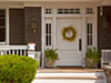 Benjamin Moore&rsquo;s sophisticated white opulence (OC-69) paint color beautifully envelops this front door.