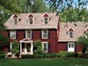 Benjamin Moore&rsquo;s almost black (2130-30) shutters make a bold statement.