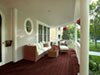Benjamin Moore&rsquo;s hodley red (HC-65) paint color on this porch floor creates a lasting impression.
