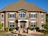 Shutters painted with Benjamin Moore&rsquo;s kingsport gray (HC-86) create subtle accent.
