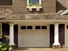 Using Benjamin Moore&rsquo;s frostine (AF-5) on the garage doors enhances this home&rsquo;s two-tone color scheme.