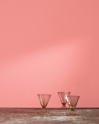 Three glass cups in front of a All-a-Blaze-painted wall.